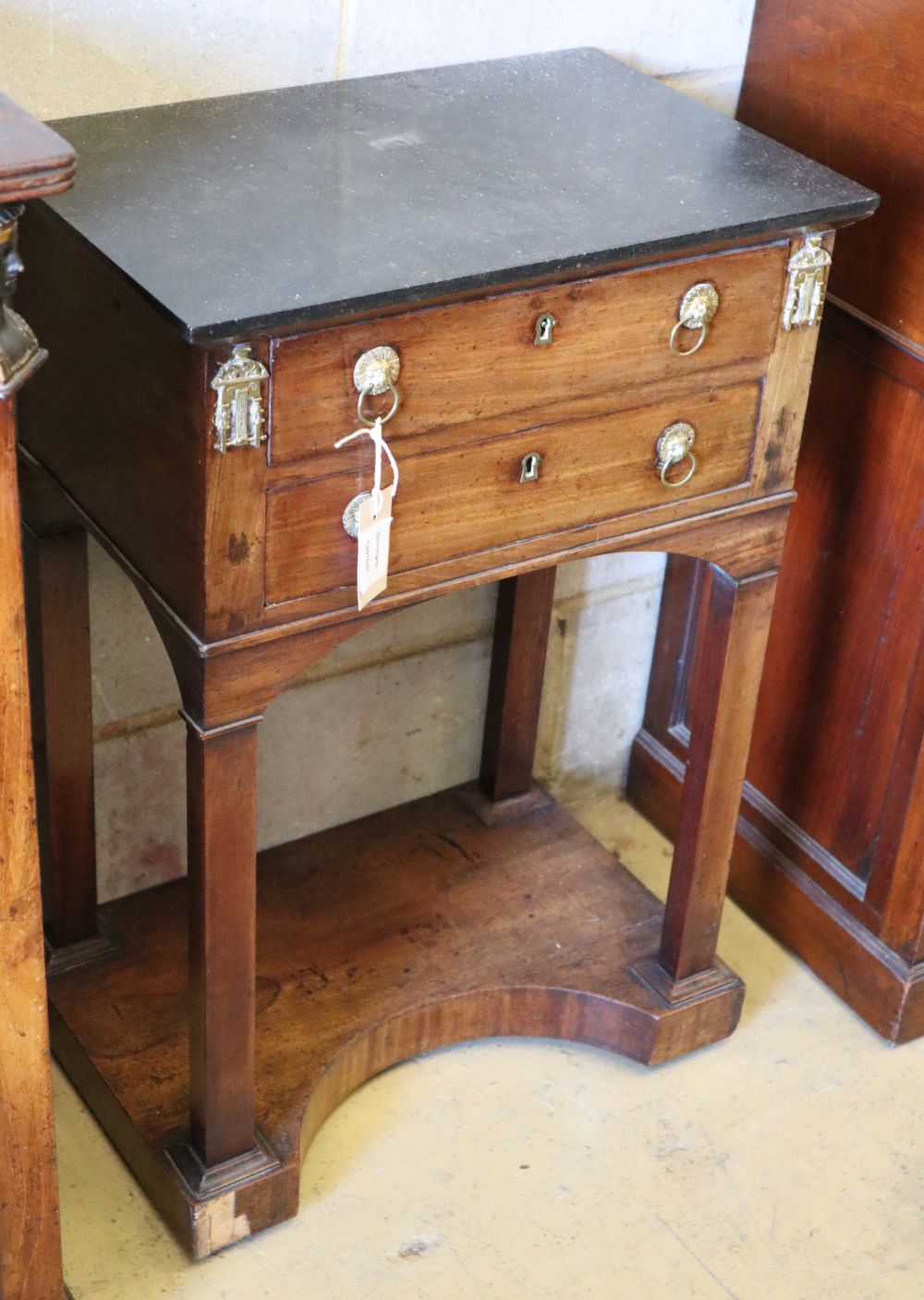 A Charles X marble top two drawer mahogany side table, W.48cm, D.32cm, H.72cm